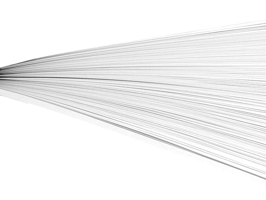 White paper quilling strips on their side against a white background.