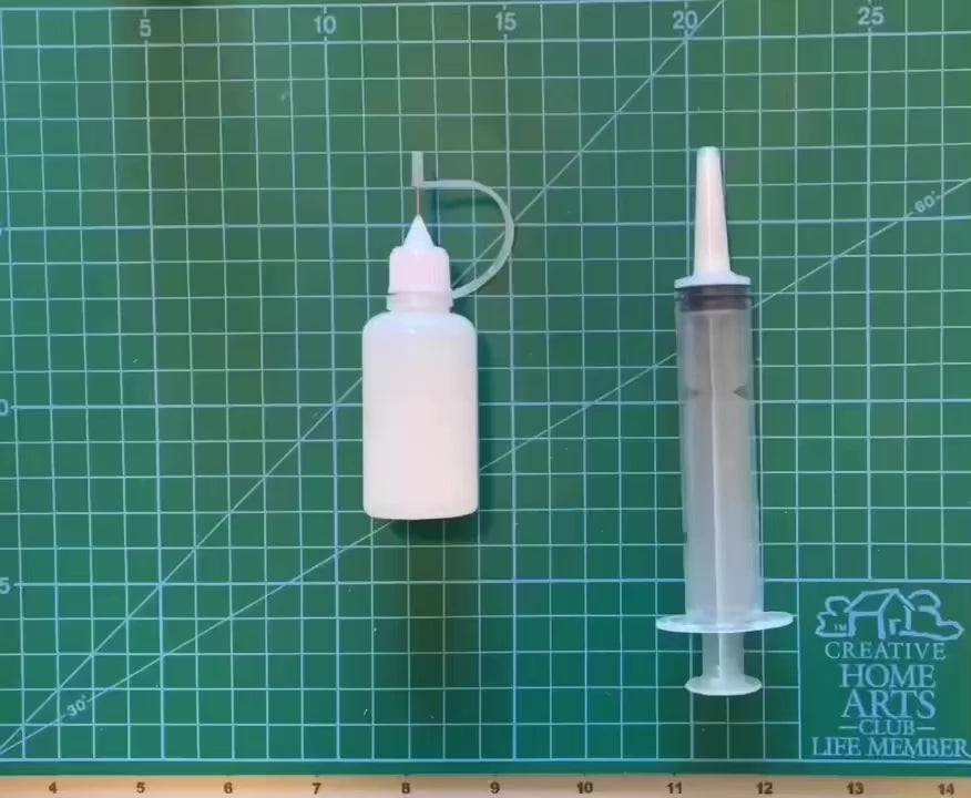 filling a quilling glue bottle using a large tip syringe. fine tip glue bottle, wide tip syringe. how to fill quilling glue bottle.