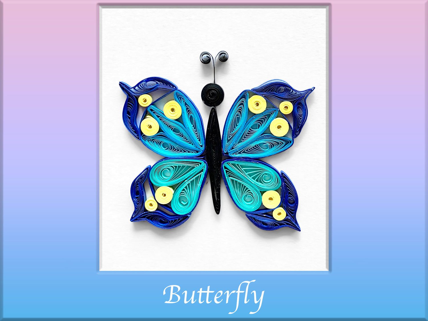 Quilled butterfly made with quilling shapes for beginners. Wings are blue and yellow and butterfly body is black.